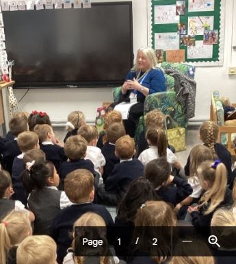 A Librarian is pictured visiting the children to give a presentation to them all about books.